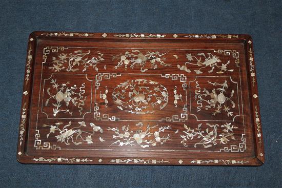 A Chinese rosewood and mother of pearl inlaid rectangular tray, late 19th century, 56 x 34cm